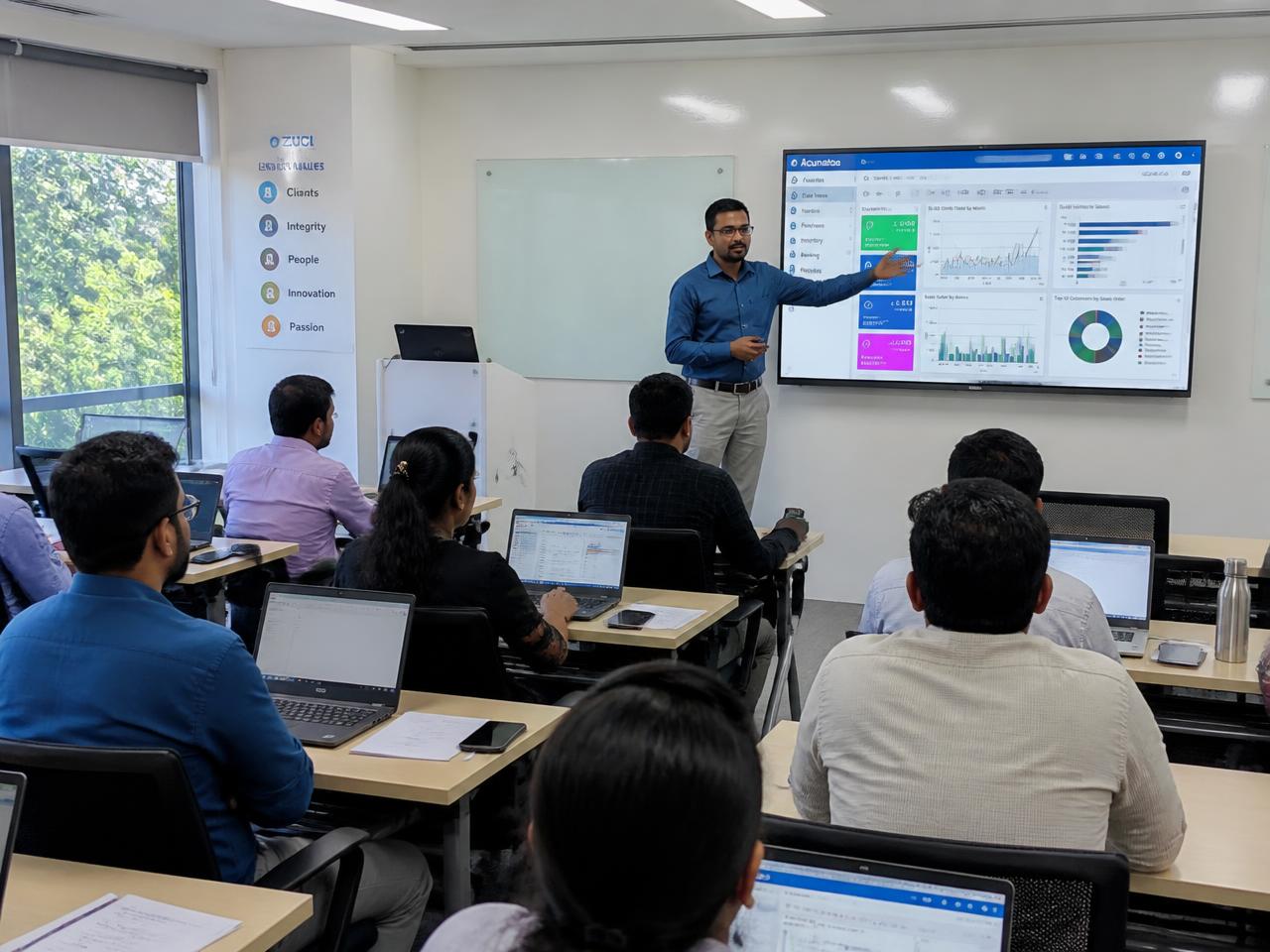 Instructor-led SAP training session at Thiranz Tech Solutions in Chennai with professionals working on laptops
